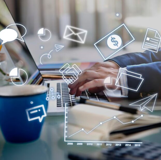 The image is a stock photo illustrating digital marketing activities, showing a person using a laptop with various icons overlaid.
